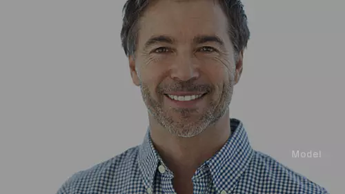 middle aged, bearded man smiling