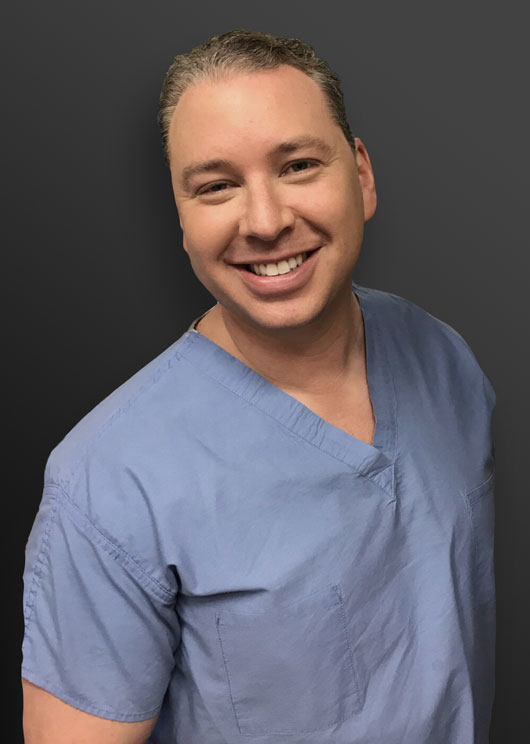 Dr. Phincus in scrubs
