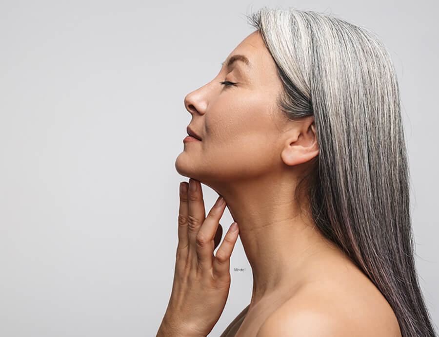 Mature woman touching her chin