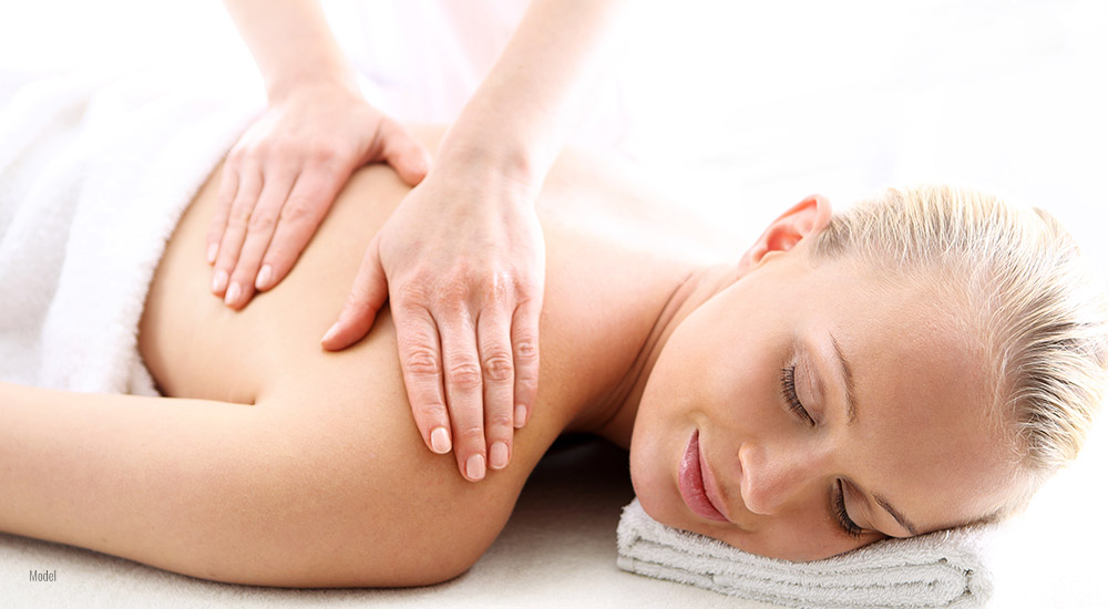 Lymphatic drainage massage is being performed on a patient.