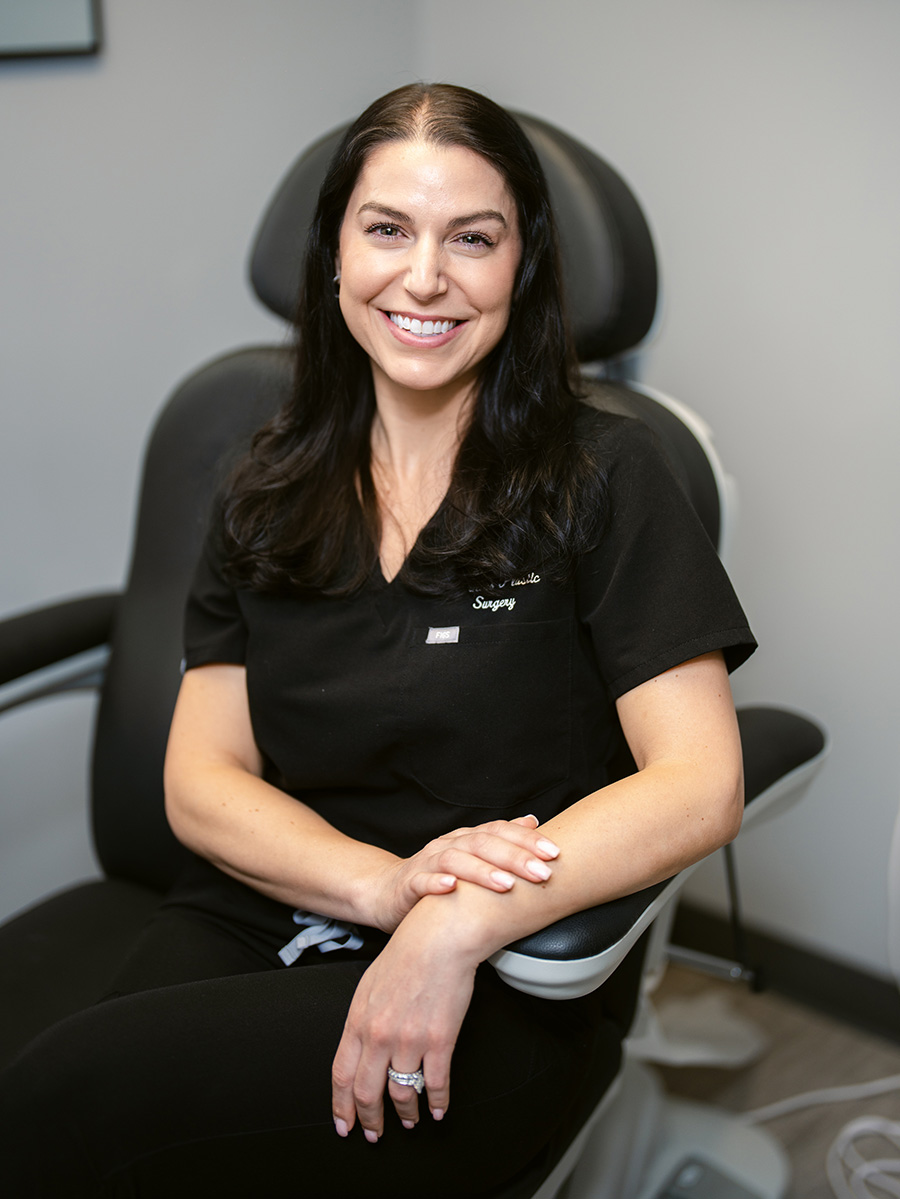 Nichole sitting in a chair