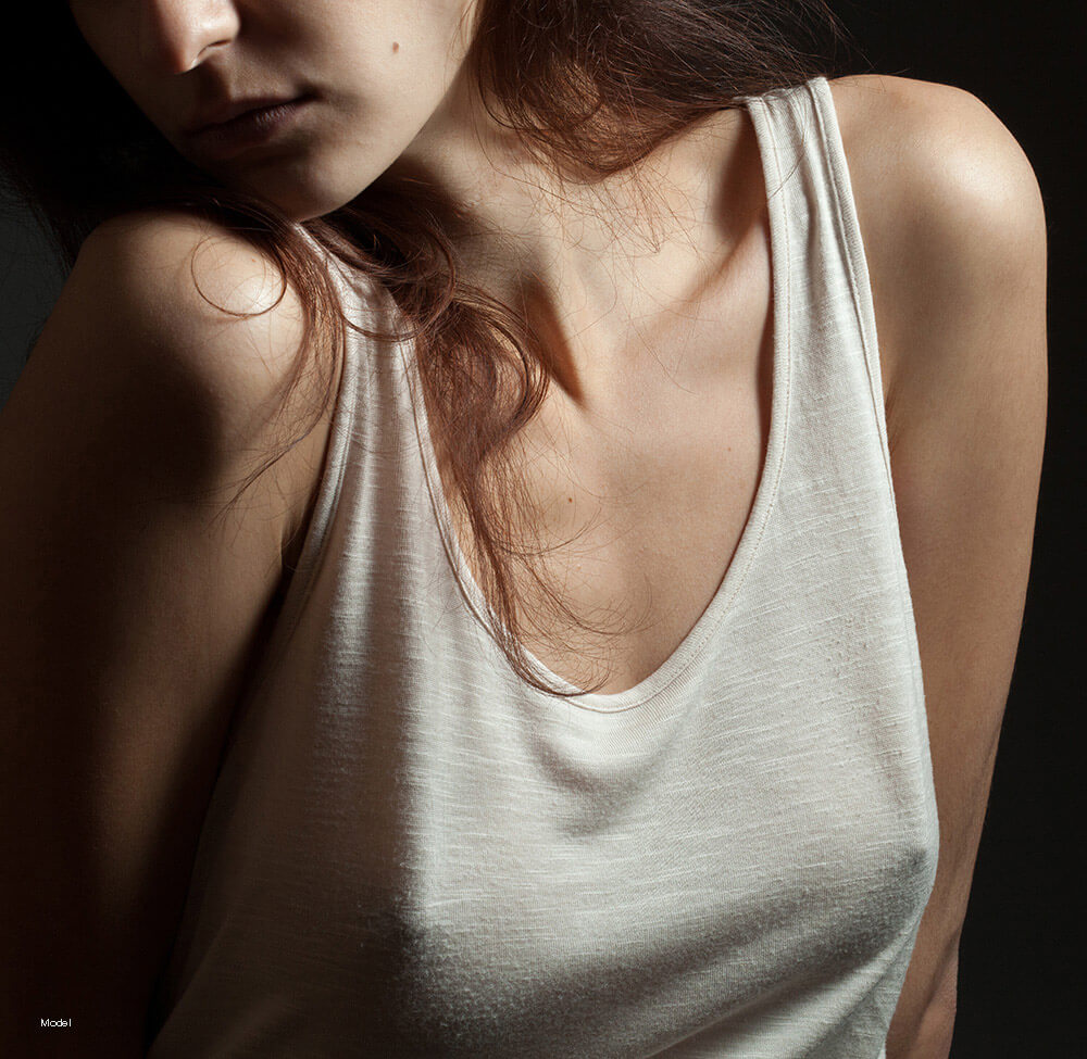 Woman in a white undershirt