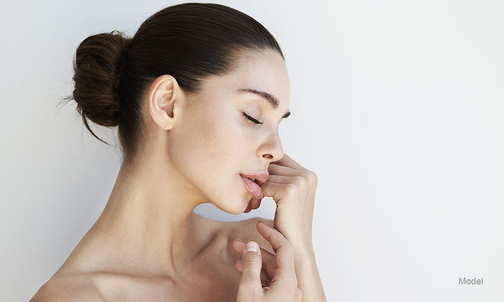 woman profile posing touching her chin